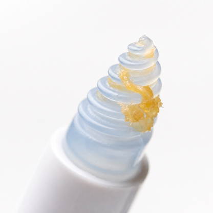 Macro shot of ear wax lifted by spiral tip