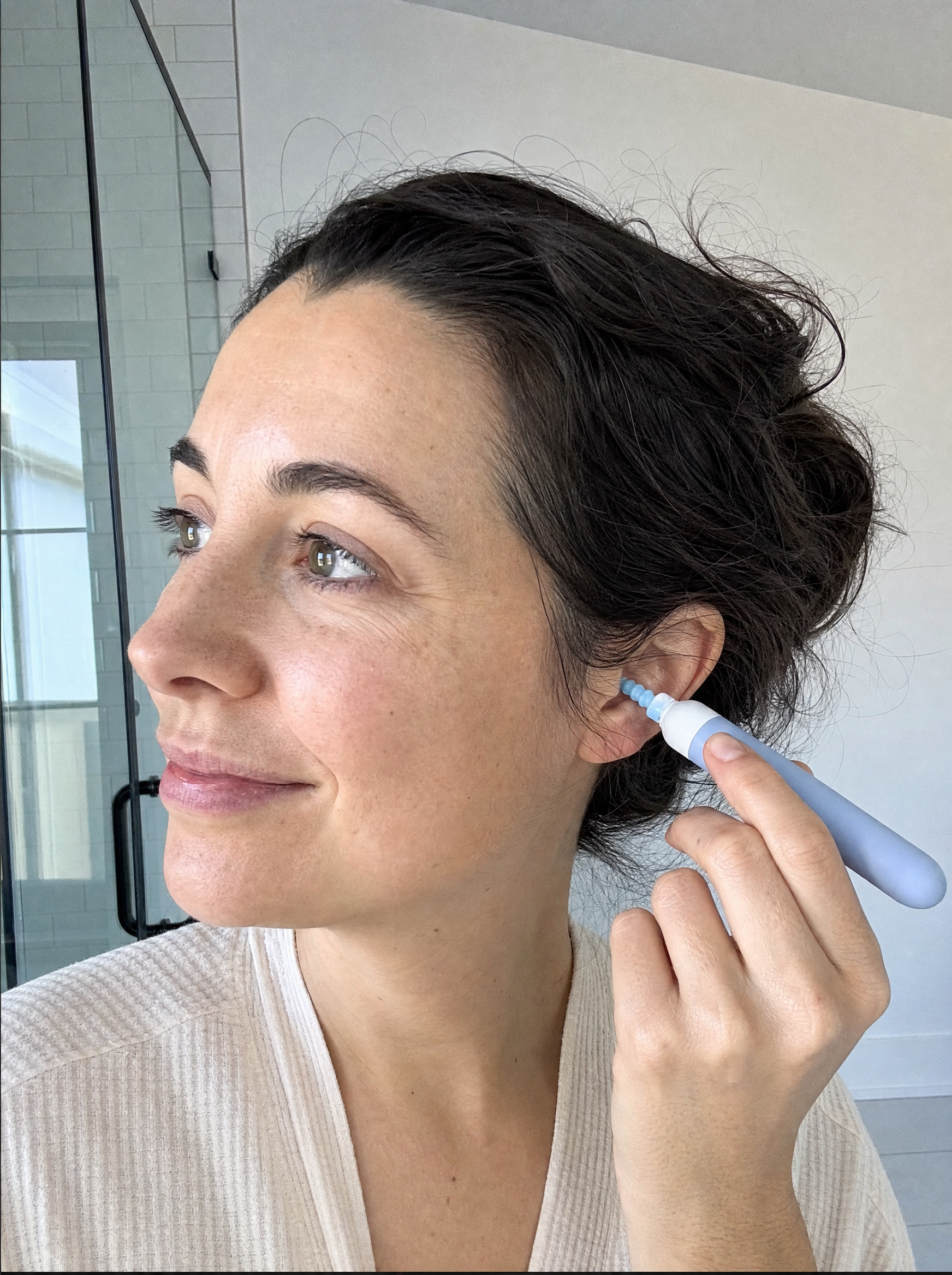 Woman using Aurica Ear Wax Remover