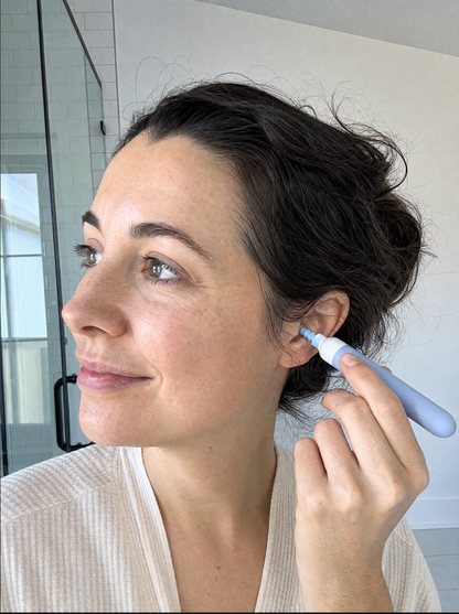 Woman using Aurica Ear Wax Remover